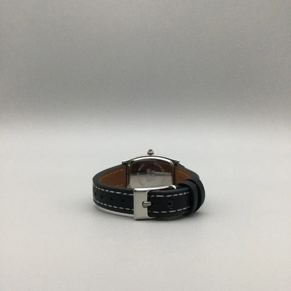 Nolan Miller Womens Watch 22mm Silver Crystals Black Leather MOP Oval Dial